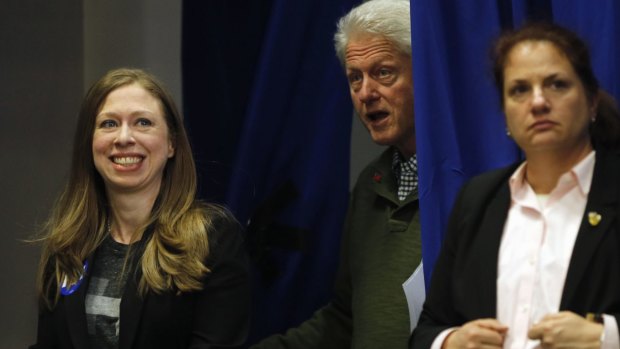 A family affair: former president Bill Clinton and his daughter Chelsea Clinton walk to the stage during a campaign stop for Hillary Clinton.