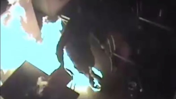 CCTV footage of an arsonist setting his feet on fire in a Richmond cafe on February 10.  