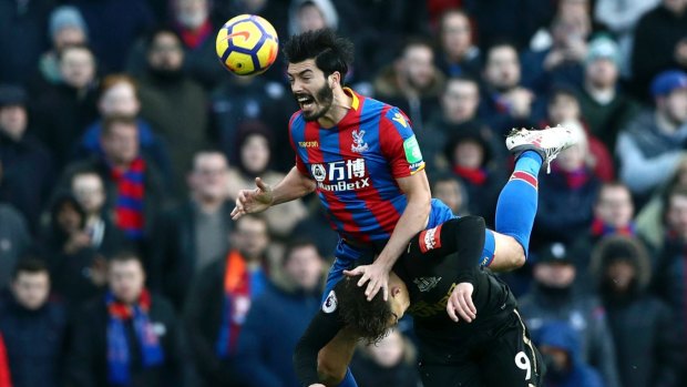 Palace's James Tomkins out jumps Newcastle's Dwight Gayle at Selhurst Park on Sunday.