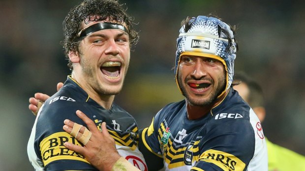 Ethan Lowe and Jonathan Thurston of the Cowboys celebrate a try during the NRL second preliminary final match.