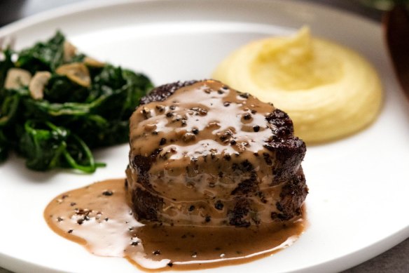 Creamy Paris mash (right) served with filet mignon with creamy peppercorn sauce, and garlic spinach.