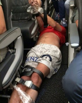A passenger on a Siberia Airlines flight was restrained by other passengers.