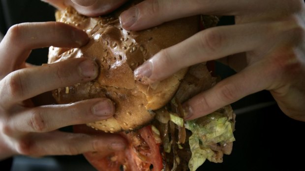 Junk food kills the gut bacteria that can help keep people thin, new book says.