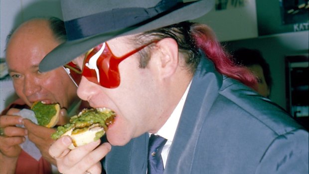 Singer Elton John enjoys a pie at Harry's Cafe de Wheels in Woolloomooloo in 1986.