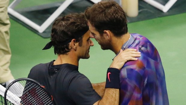 Federer congratulates del Potro.