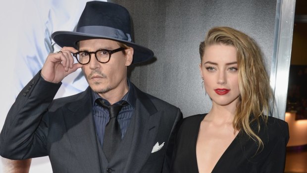 Actor Johnny Depp, pictured with wife Amber Heard, has brought his two Yorkshire terriers into the country without clearing strict animal quarantine. 