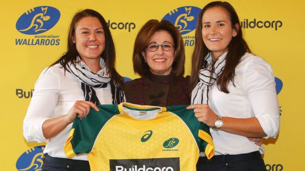 Josephine Sukkar with Wallaroos Sharni Williams and Shannon Parry. 