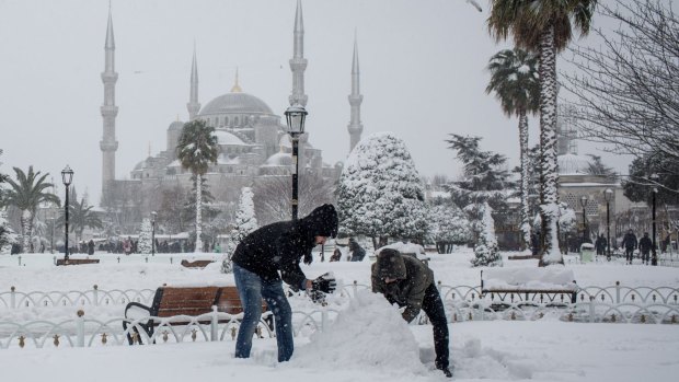 A New Year's Eve snowman is built in front of the Blue Mosque in Istanbul.