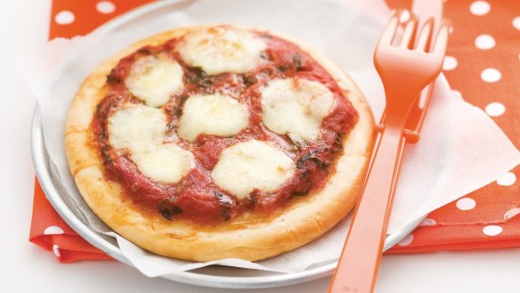 Kids can add extra toppings to these fairly plain mini pizzas.