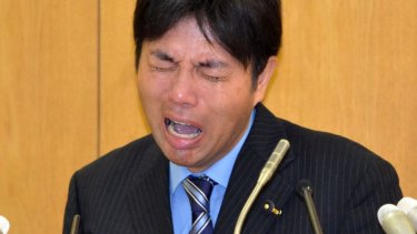 Ryutaro Nonomura weeps during press conference after a corruption inquiry.