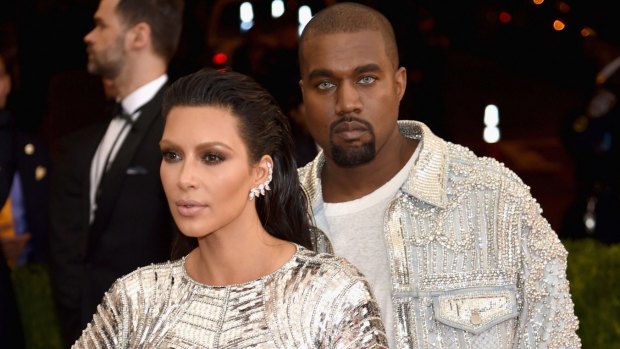 Kim Kardashian and Kanye West looking ahead in silver at the Manus x Machina: Fashion In An Age Of Technology Gala at Metropolitan Museum of Art in  New York