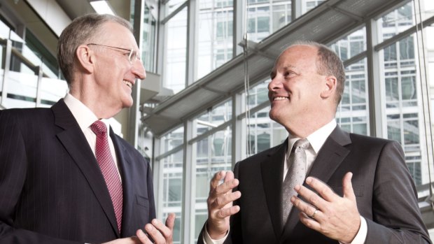 IAG chief executive Mike Wilkins, left, is stepping down to be succeeded in November by Peter Harmer. The insurance company has scrapped plans to expand in China. 