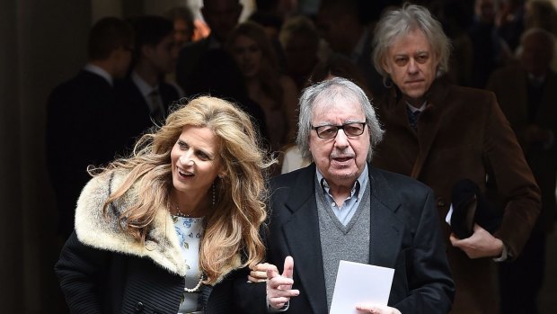 Bill Wyman and Suzanne Wyman leave after the wedding of Jerry Hall to Rupert Murdoch at St Brides Church, Fleet Street, on Saturday.