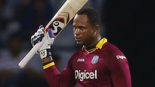 West Indies' Marlon Samuels acknowledges the crowd after scoring a century during a one-day international against Sri Lanka, in Pallekele, Sri Lanka.