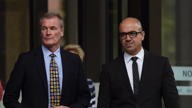 Gordon Wood (left) leaves NSW Supreme Court. Mr Wood is suing NSW for malicious prosecution, accusing the state of misconduct, through its senior prosecutor.