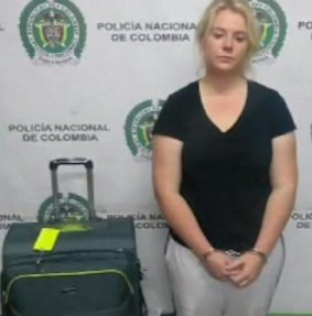 Cassandra Sainsbury photographed beside her luggage.