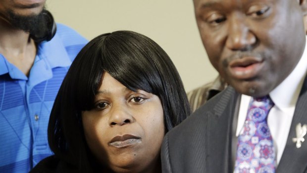 Family: Samaria Rice listens to her lawyer at a news conference held after the shooting of her son, Tamir.