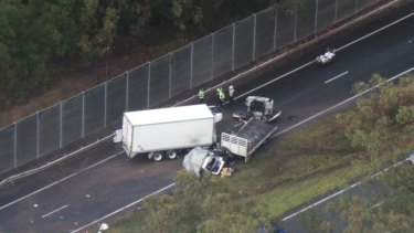 A two-truck crash blocks the westbound lanes on the Warrego Highway at Brassall.