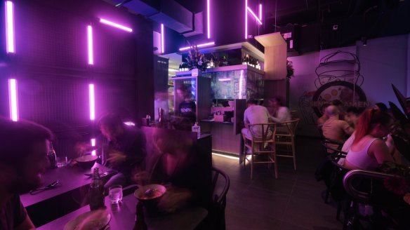 The moody, neon-dashed interior of Senpai Ramen in Chatswood.