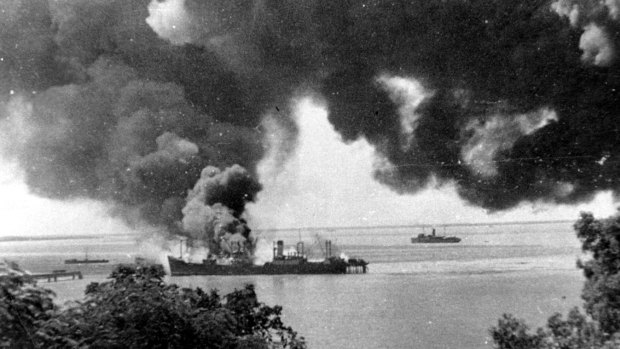 The SS Barossa burns after being bombed by the Japanese. 