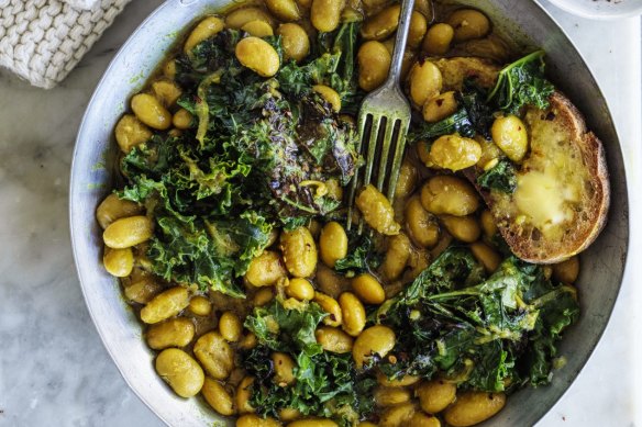 Budget-friendly beans on toast, pictured with pan-fried kale (optional).