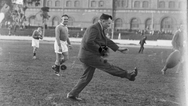 Maroon man: Harry Sunderland has a kick during an Australian training session in 1933.