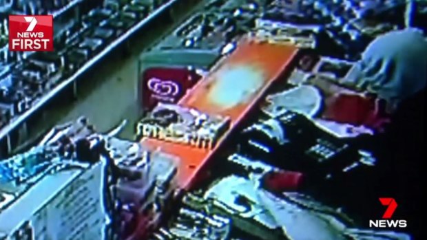 CCTV footage shows one of the alleged thieves taking the cash register from a St Albans milk bar.
