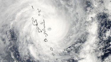 A Nasa satellite image of cyclone Pam as the eye of the storm passes just east of Vanuatu.