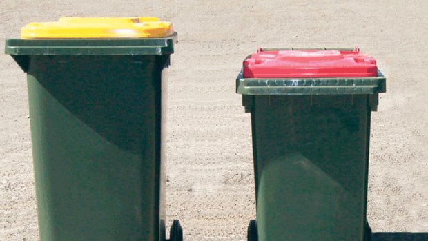 Newcastle council wheelie bins. 240 litre recycling bin (yellow lid), smaller garbage bin (red lid) and 240 litre greenwaste bin (green lid). Photo Supplied. Story Matthew Benns. SHD News. 19 March 2010