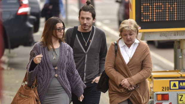 Kristen Shroder's mother, Roxene Dennis, arrives at court with her children. 