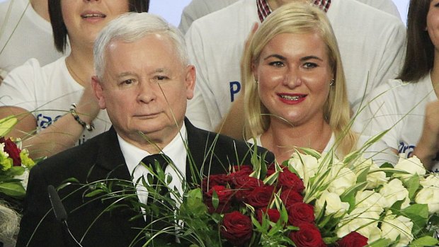 Jaroslaw Kaczynski, left, leader of Poland's Law and Justice Party, at the party's headquarters on election night in October. His party's victory ended eight years in power of the pro-EU, pro-business Civic Platform.