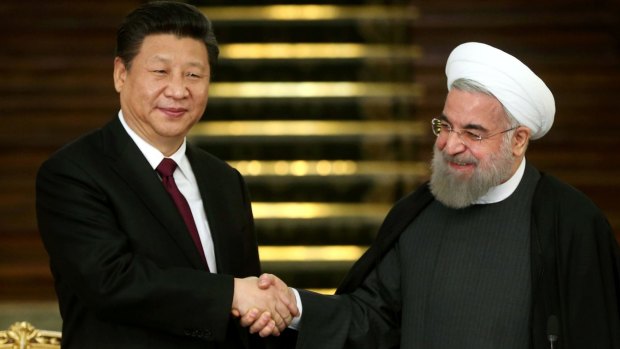 Expanding ties: Chinese President Xi Jinping (left) and Iranian President Hassan Rouhani.