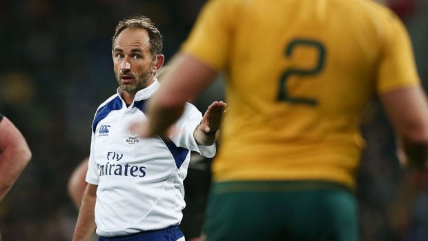 Man in the middle: Referee Romain Poite looks toward Australian captain Stephen Moore during the Bledisloe Cup match in Wellington.