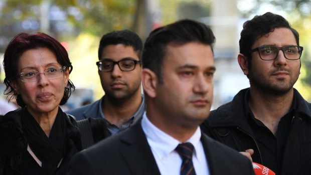 Charlie Sharobeem, right, outside ICAC with mother, Eman, left, and brother Richard, rear. Lawyer Arjun Chhabra is in front.