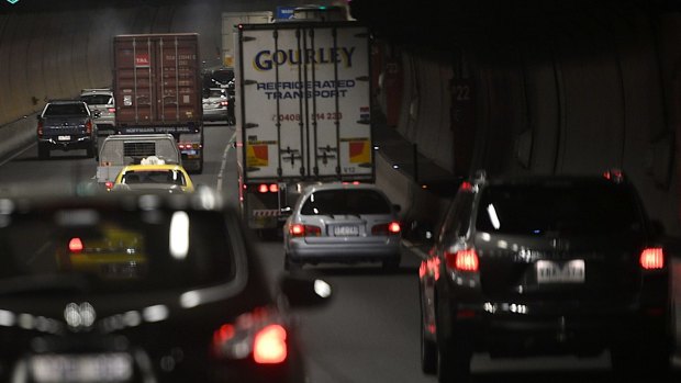 Traffic is backing up after a car flipped in the Burnley Tunnel.