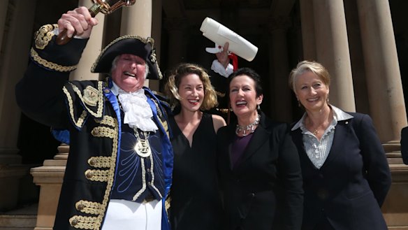 In better days: Town crier Graham Keating, Jess Miller, Sydney Lord Mayor Clover Moore and Professor Kerryn Phelps on the steps of Town Hall at the proclamation of the 2016 council.