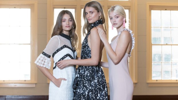 Models showcase new brands acquired by David Jones. Indiarose wears a dress by Self Portrait, Julia Gardell wears Aje, and Lexi Graham wears a dress by By Johnny.