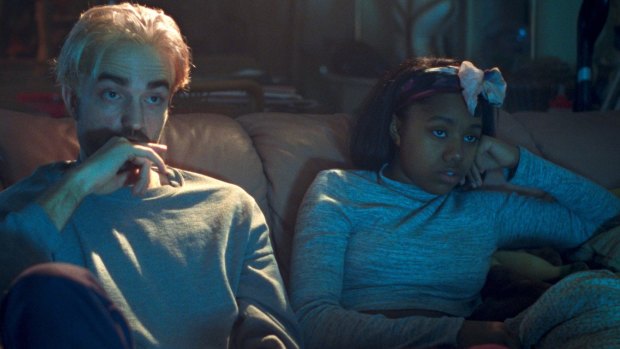 Robert Pattinson as Connie Nikas and Talia Webster as Crystal in a scene from <i>Good Time</i>.