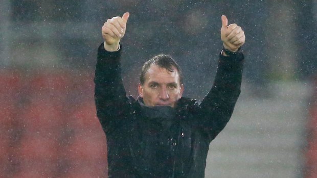 Brendan Rodgers acknowledges the fans after Liverpool's victory.