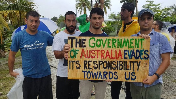 Men protest their treatment at the Manus Island processing centre.