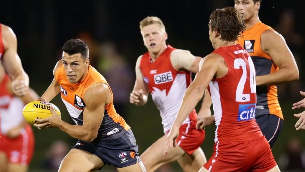 Bragging rights: The Swans draw first blood in this year's first cross-town clash.