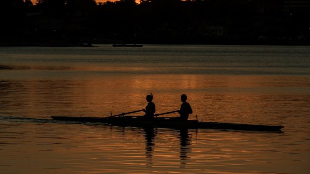 Rowers in the dying days of daylight savings. 
