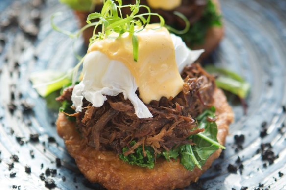Bluestone Benedict: Roti piled with braised beef cheek, kale, poached egg and hollandaise.