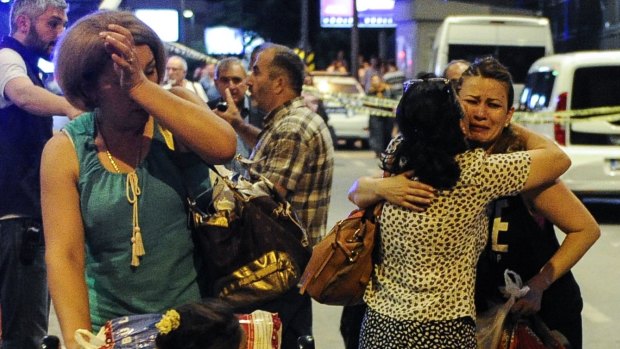 Passengers who survived from the suicide bomb attack cry as they leave Turkey's largest airport, Istanbul Ataturk. 