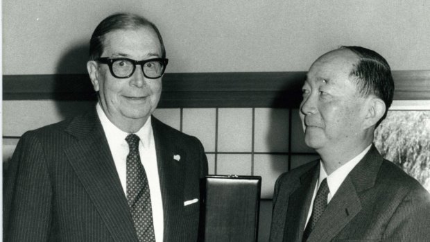 Former CSR chairman managing director Sir James Vernon (left) in 1983, receiving an honour from the Japanese ambassador.