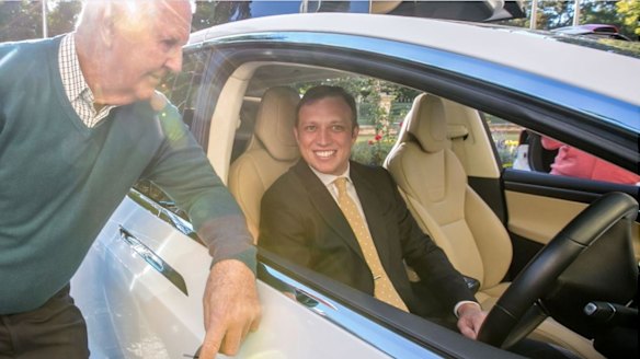 New dawn: Electric car owner Rodney Peachey from Southport with Environment Minister Steve Miles at the launch of a network of 18 chargers to be built along the Queensland coastline in six months.
