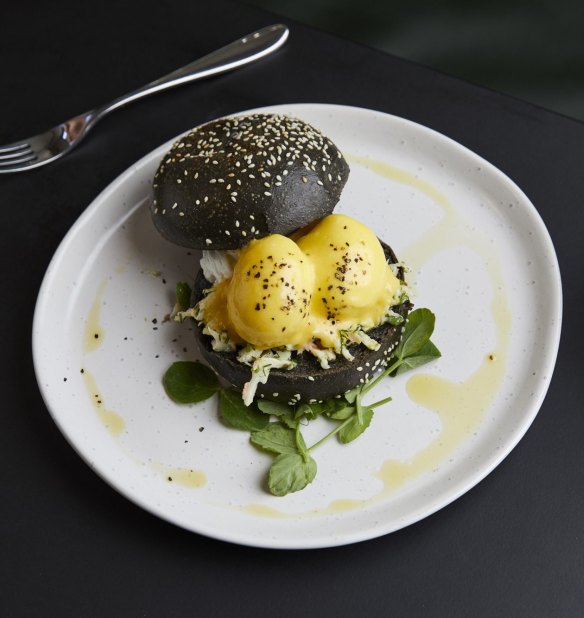 Lobster benedict with citrus hollandaise, soft herbs, a black bun and 64-degree eggs. 