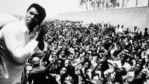 Muhammad Ali with fans in Zaire, the location in 1974 for the "Rumble in the Jungle" fight that pitted Ali against George Foreman, the then world heavyweight champion. Ali won.