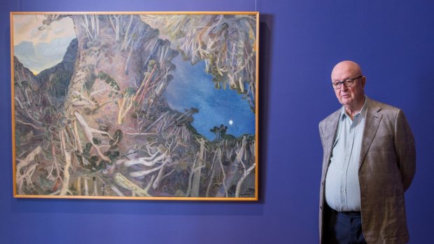 Artist William Robinson with <i>Sunset and Misty Moon, Beachmont 1993</i> at the William Robinson Gallery in Brisbane in May 2016.