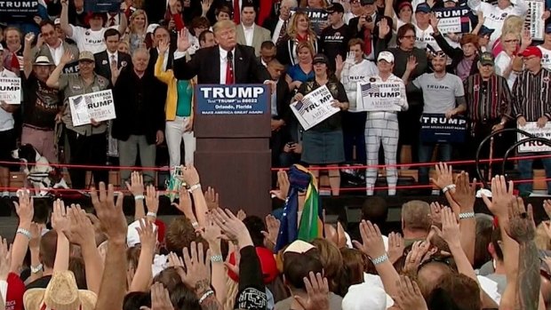 Donald Trump asks supporters to pledge their allegiance to him during a rally in Florida.